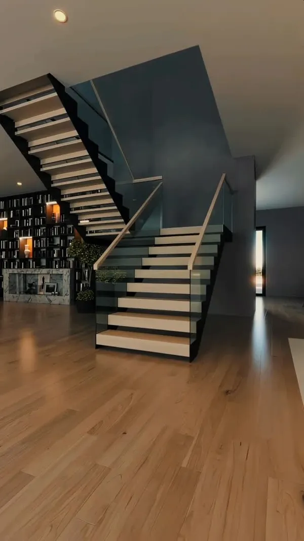 Glass stair railing system in a modern Los Angeles open-plan home